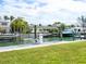 Private dock with boat lift in a beautiful canal setting at 548 Ketch Ln, Longboat Key, FL 34228
