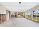 Large living room under renovation with exposed framing and new windows at 548 Ketch Ln, Longboat Key, FL 34228