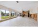Living area with partial kitchen demo and waterfront view at 548 Ketch Ln, Longboat Key, FL 34228