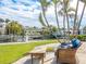 Relaxing patio overlooking the canal, with comfy seating at 548 Ketch Ln, Longboat Key, FL 34228