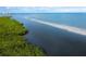 Aerial view of waterfront property and mangrove shoreline at 560 Harbor Point Rd, Longboat Key, FL 34228