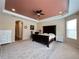 Large main bedroom with dark wood furniture and carpeted floors at 5718 Westhaven Cv, Bradenton, FL 34203