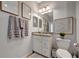 Modern bathroom with granite countertop, white vanity, and updated fixtures at 5904 Wake Forest Run # 102, Bradenton, FL 34211