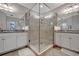 Double vanity bathroom with a large glass shower at 5904 Wake Forest Run # 102, Bradenton, FL 34211