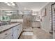 Elegant bathroom with granite countertops and a large walk-in shower at 5904 Wake Forest Run # 102, Bradenton, FL 34211