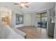 Spacious Primary bedroom with wood-look floors and access to a private balcony at 5904 Wake Forest Run # 102, Bradenton, FL 34211