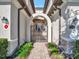 Elegant entryway with arched gate and walkway at 5904 Wake Forest Run # 102, Bradenton, FL 34211