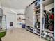 Organized garage with built-in shelving and ample storage space at 5904 Wake Forest Run # 102, Bradenton, FL 34211