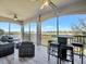 Spacious lanai with outdoor seating and stunning golf course views at 5904 Wake Forest Run # 102, Bradenton, FL 34211