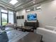 Sophisticated lounge with comfortable seating and a large TV at 5904 Wake Forest Run # 102, Bradenton, FL 34211