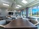 Relaxing lounge area with comfortable seating and large windows at 5904 Wake Forest Run # 102, Bradenton, FL 34211