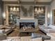 Relaxing clubhouse lounge with a modern fireplace and comfortable seating at 5904 Wake Forest Run # 102, Bradenton, FL 34211
