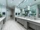 Modern restroom with multiple sinks and sleek gray cabinets at 5904 Wake Forest Run # 102, Bradenton, FL 34211