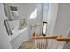 Modern open staircase with wood and tile; high ceilings at 5904 Wake Forest Run # 102, Bradenton, FL 34211