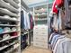 Large walk-in closet with ample shelving and hanging space at 5904 Wake Forest Run # 102, Bradenton, FL 34211