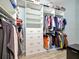 Spacious walk-in closet with custom shelving and drawers at 5904 Wake Forest Run # 102, Bradenton, FL 34211