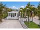 Aerial view of a charming coastal cottage and surrounding neighborhood at 600 Fox St, Longboat Key, FL 34228