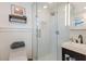 Bathroom with a walk-in shower and modern vanity at 600 Fox St, Longboat Key, FL 34228