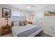 Main bedroom with a king-size bed and wood accents at 600 Fox St, Longboat Key, FL 34228