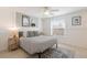 Guest bedroom with a queen-size bed and coastal decor at 600 Fox St, Longboat Key, FL 34228