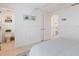 Bedroom with ensuite bathroom access and coastal decor at 600 Fox St, Longboat Key, FL 34228
