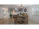 Charming dining area with rustic table and patterned chairs at 600 Fox St, Longboat Key, FL 34228