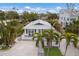 Cute cottage with white picket fence and walkway at 600 Fox St, Longboat Key, FL 34228