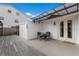 Small patio with table and chairs next to a shed at 600 Fox St, Longboat Key, FL 34228