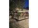 Relaxing backyard patio with pergola, lighting, and seating at 600 Fox St, Longboat Key, FL 34228