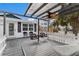 Relaxing pergola with ceiling fan and comfortable seating at 600 Fox St, Longboat Key, FL 34228