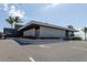 Modern restaurant building with sleek design and palm trees at 600 Fox St, Longboat Key, FL 34228