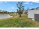 Lake view from grassy backyard at 6111 Fairmont Ln, Palmetto, FL 34221