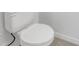 Clean bathroom with a toilet and closed toilet lid at 6111 Fairmont Ln, Palmetto, FL 34221