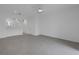 Open living room with tile floors and views into the kitchen at 6111 Fairmont Ln, Palmetto, FL 34221