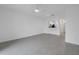 Open living room with tile floors and kitchen views at 6111 Fairmont Ln, Palmetto, FL 34221