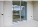 Sliding glass door to screened patio at 6111 Fairmont Ln, Palmetto, FL 34221