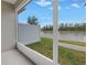 Screened patio overlooking a tranquil lake at 6111 Fairmont Ln, Palmetto, FL 34221