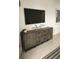 Stylish media console with ample storage and a large TV at 6111 Fairmont Ln, Palmetto, FL 34221