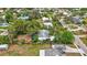 Single-story home surrounded by lush vegetation at 6231 Beechwood Ave, Sarasota, FL 34231