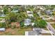 Single-story home surrounded by lush vegetation at 6231 Beechwood Ave, Sarasota, FL 34231