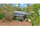 Property features a private screened pool and lush landscaping at 6231 Beechwood Ave, Sarasota, FL 34231