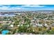 Aerial view of a home nestled in a neighborhood with water views at 6231 Beechwood Ave, Sarasota, FL 34231