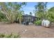 Private backyard with screened pool and tropical landscaping at 6231 Beechwood Ave, Sarasota, FL 34231