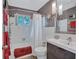 Clean bathroom with a tub, shower, and modern vanity at 6231 Beechwood Ave, Sarasota, FL 34231
