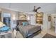 Spacious bedroom with a large bed, walk-in closet, and artwork at 6231 Beechwood Ave, Sarasota, FL 34231
