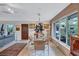 Bright dining room with glass table and large windows at 6231 Beechwood Ave, Sarasota, FL 34231