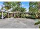 Mid-century home with carport and tropical landscaping at 6231 Beechwood Ave, Sarasota, FL 34231