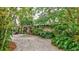Mid-century home nestled in lush tropical landscaping at 6231 Beechwood Ave, Sarasota, FL 34231