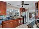 Modern kitchen featuring dark wood cabinets and granite countertops at 6231 Beechwood Ave, Sarasota, FL 34231