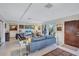 Relaxing living room with gray sofa and large windows at 6231 Beechwood Ave, Sarasota, FL 34231